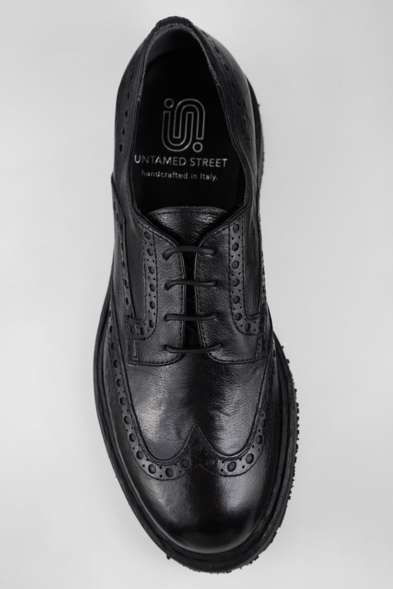 DRAKE jet-black brogue derby shoes.