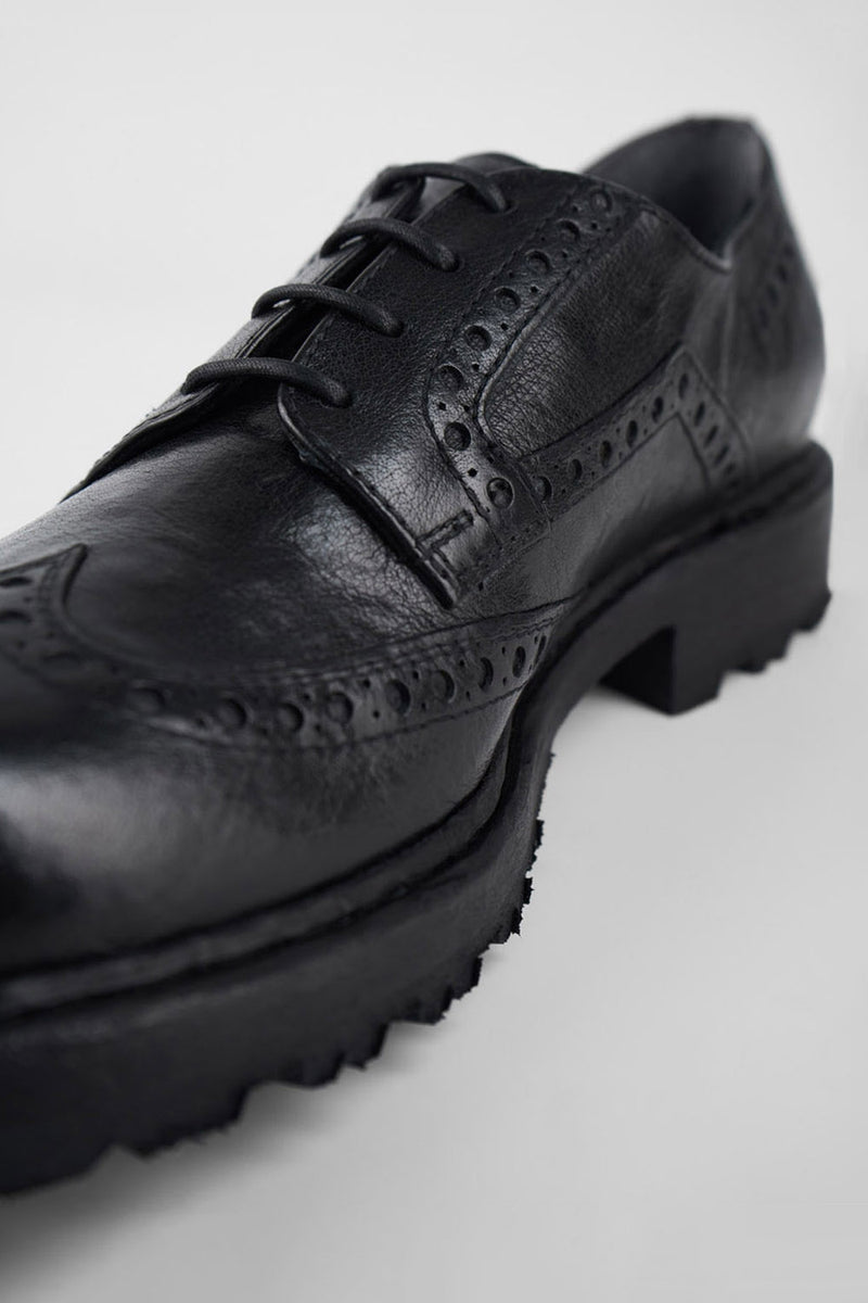 DRAKE jet-black brogue derby shoes.