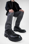 DRAKE jet-black brogue derby shoes.