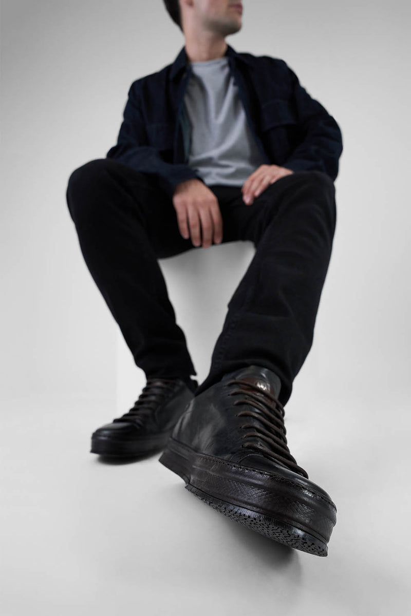 HAYES black distressed welted sneakers.