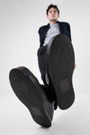 HAYES black distressed welted sneakers.