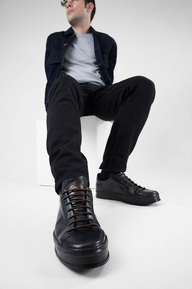 HAYES black distressed welted sneakers.