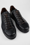 HAYES black distressed welted sneakers.