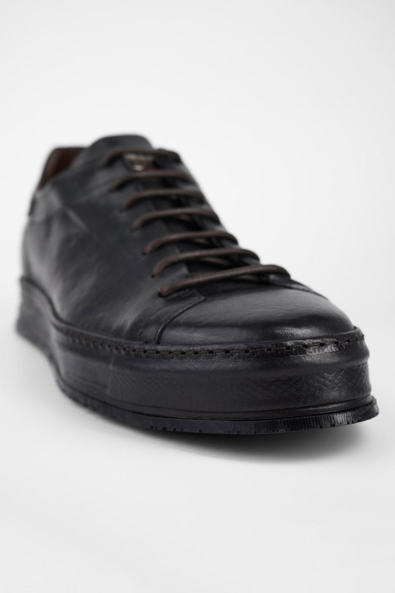 HAYES black distressed welted sneakers.