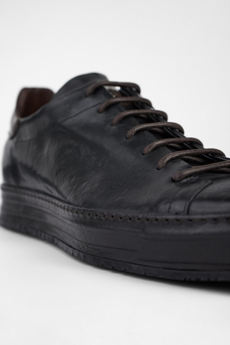 HAYES black distressed welted sneakers.