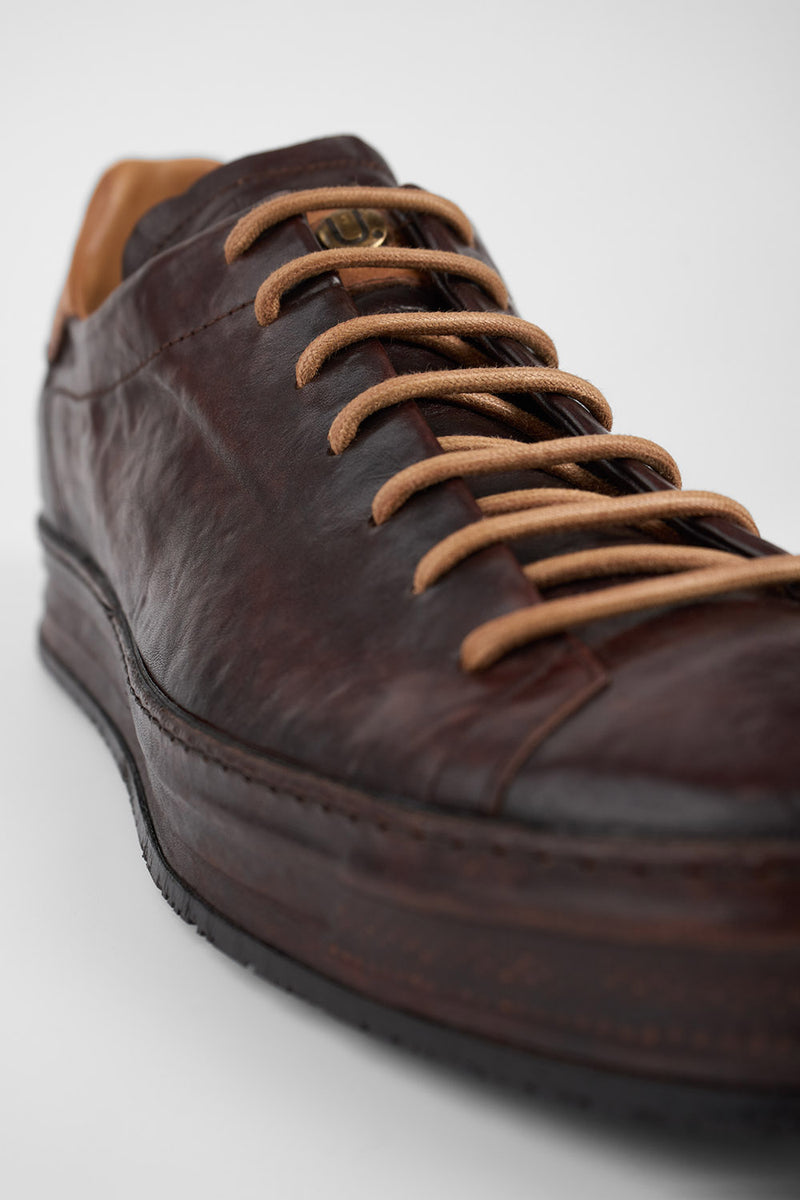 HAYES dark-cocoa distressed welted sneakers.