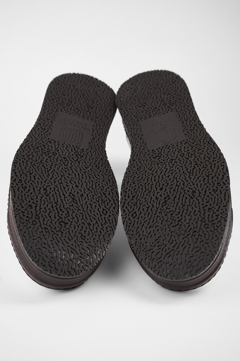 HAYES dark-cocoa distressed welted sneakers.
