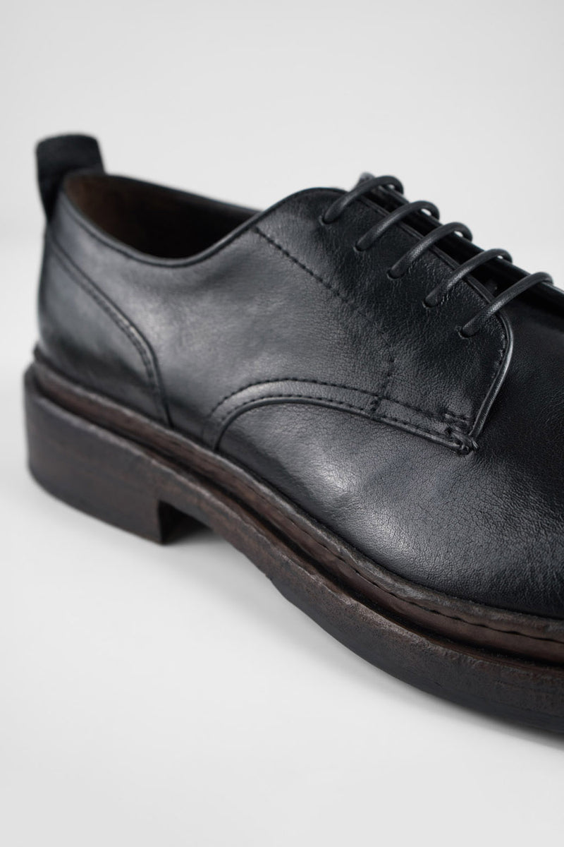 LAMBETH jet-black welted derby shoes.