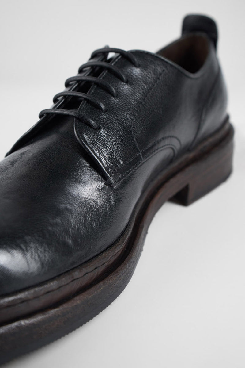 LAMBETH jet-black welted derby shoes.