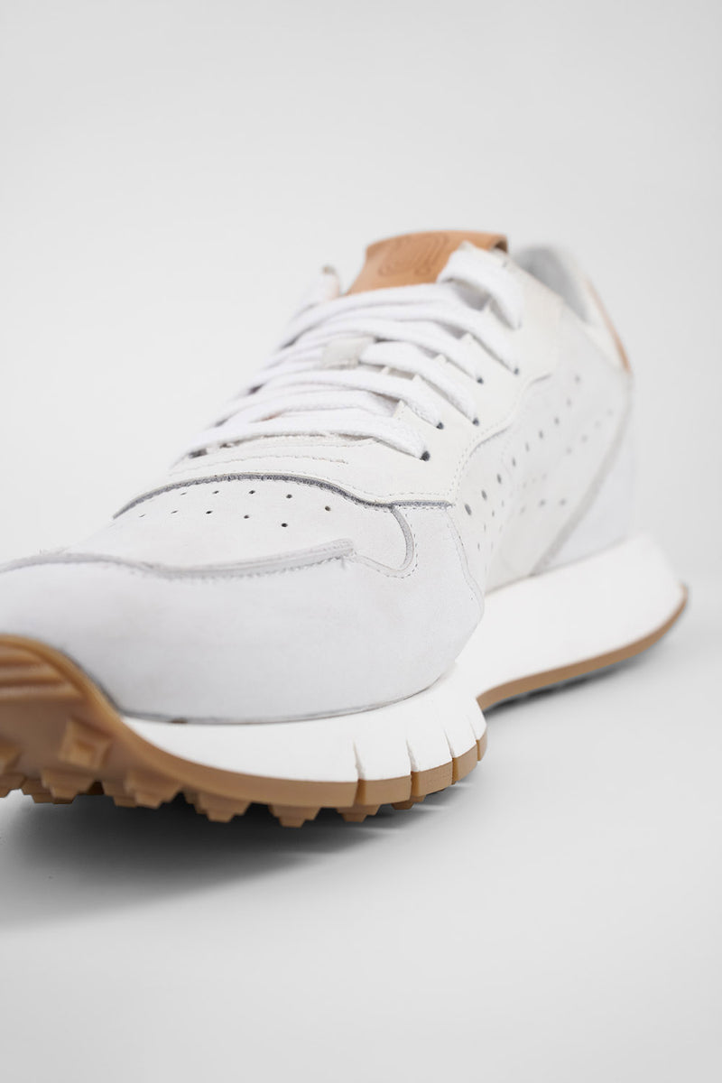 PEARCE limestone-white nubuck runners.