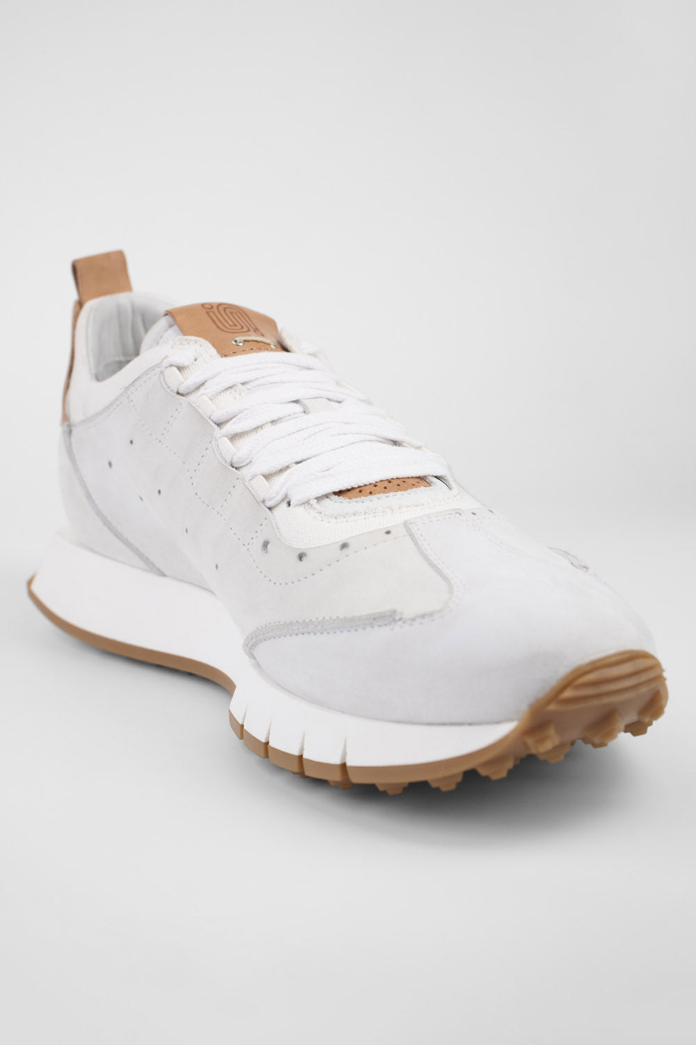 PEARCE limestone-white nubuck wingtip runners.