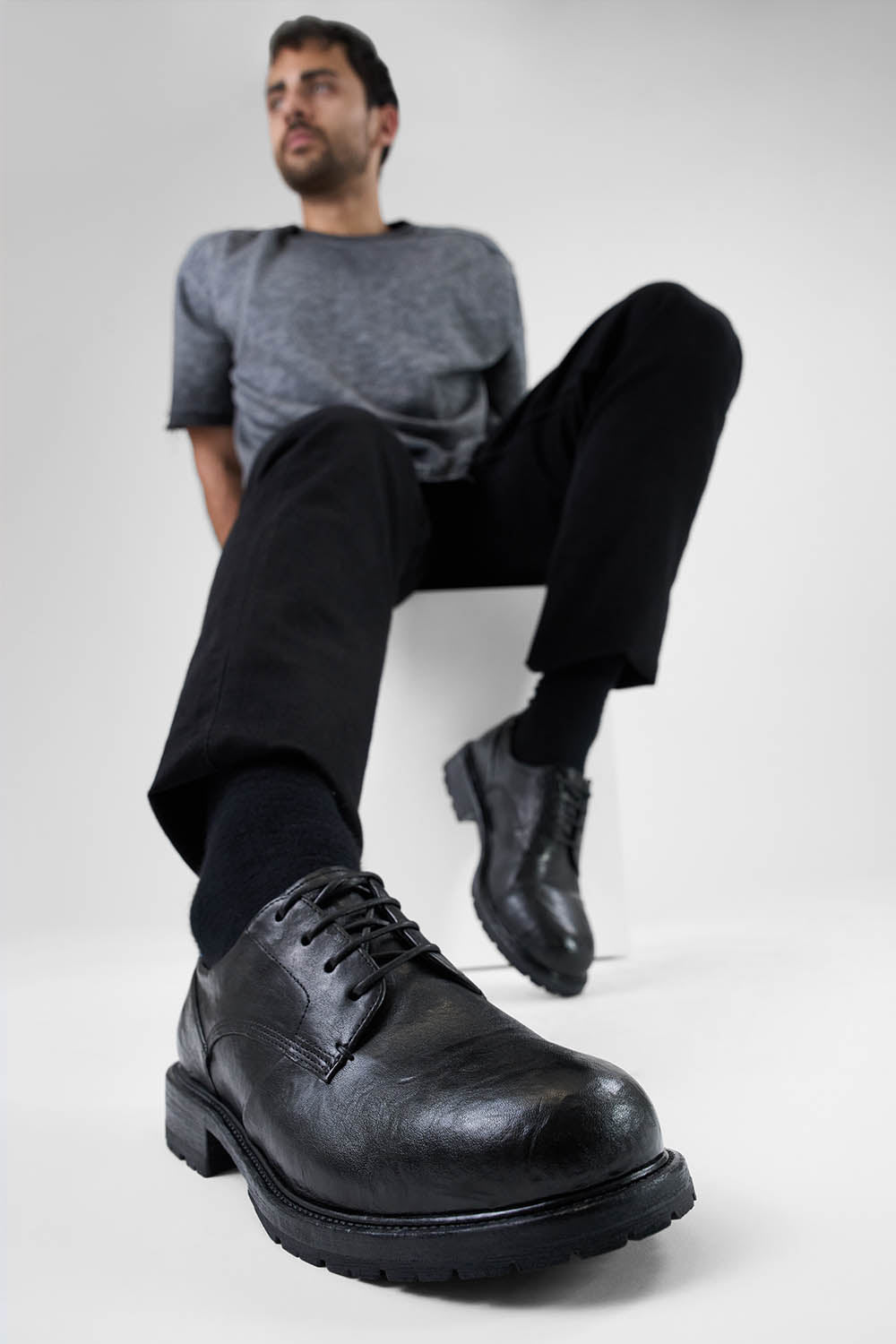 ROWLEY coal-black folded derby shoes.