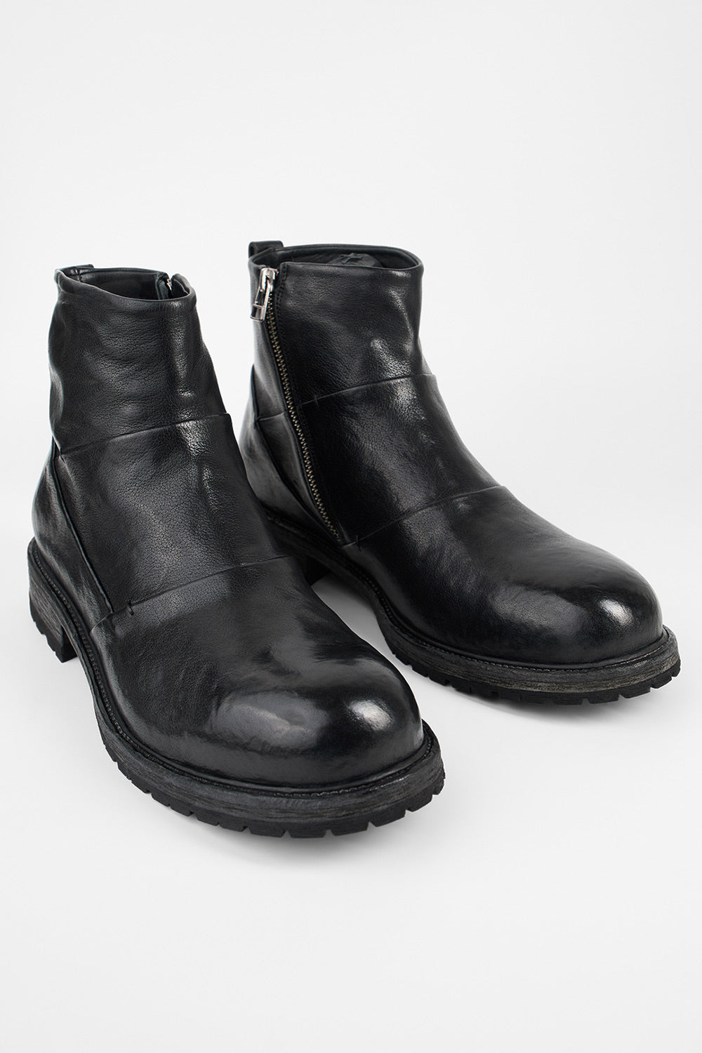 ROWLEY jet-black folded laceless boots.