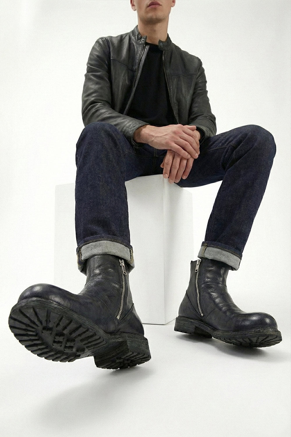 ROWLEY jet-black folded laceless boots.