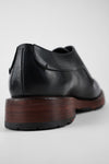 SCOTT jet-black derby shoes.
