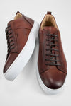 SKYE cognac folded patina sneakers.