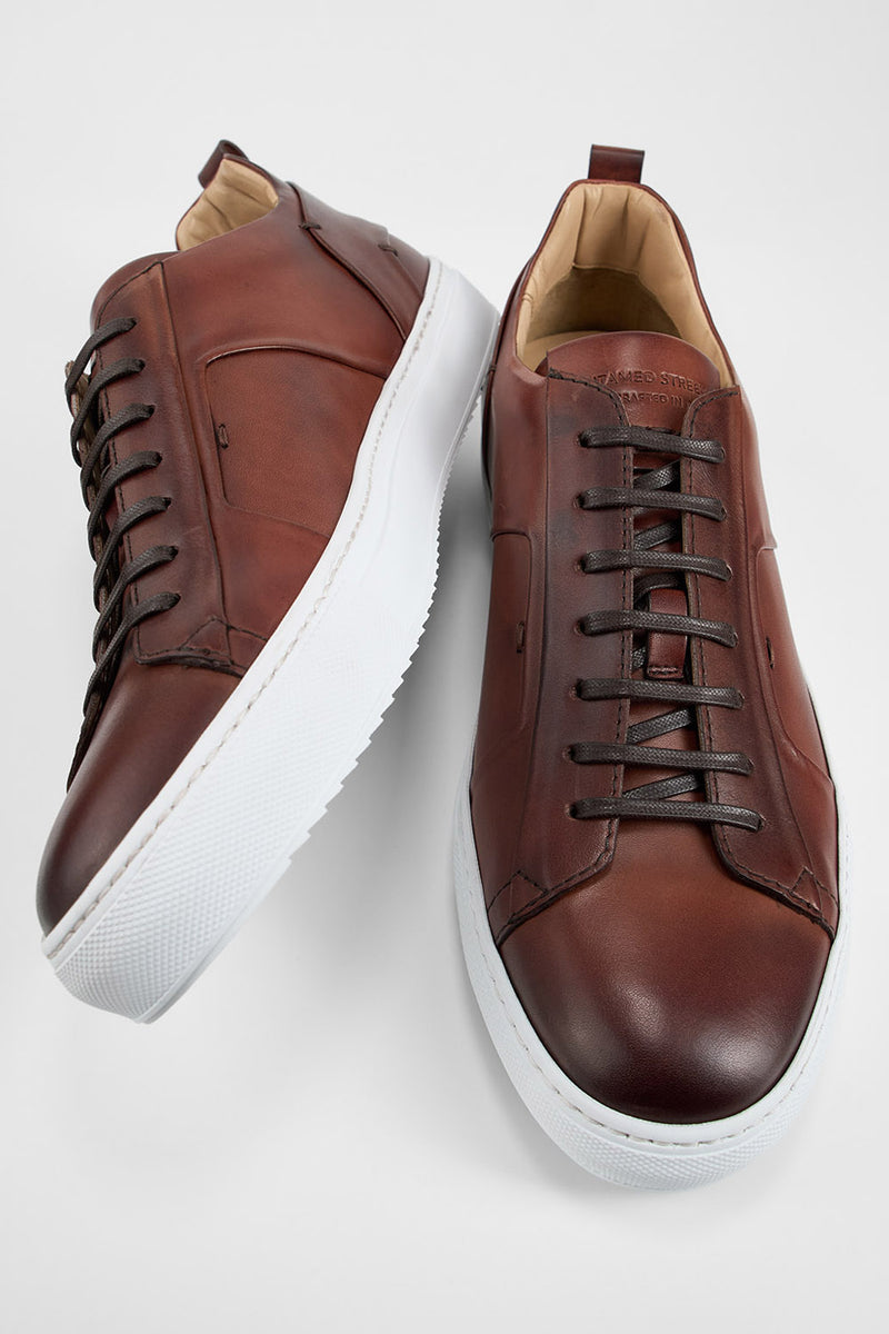 SKYE cognac folded patina sneakers.