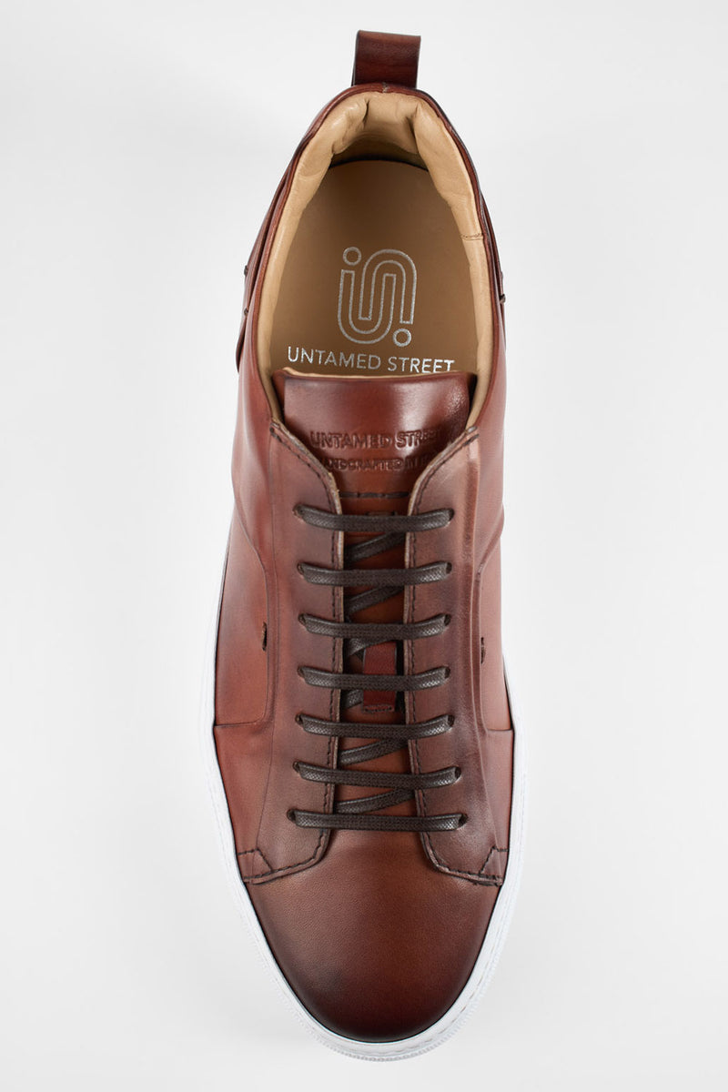 SKYE cognac folded patina sneakers.