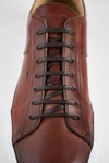 SKYE cognac folded patina sneakers.