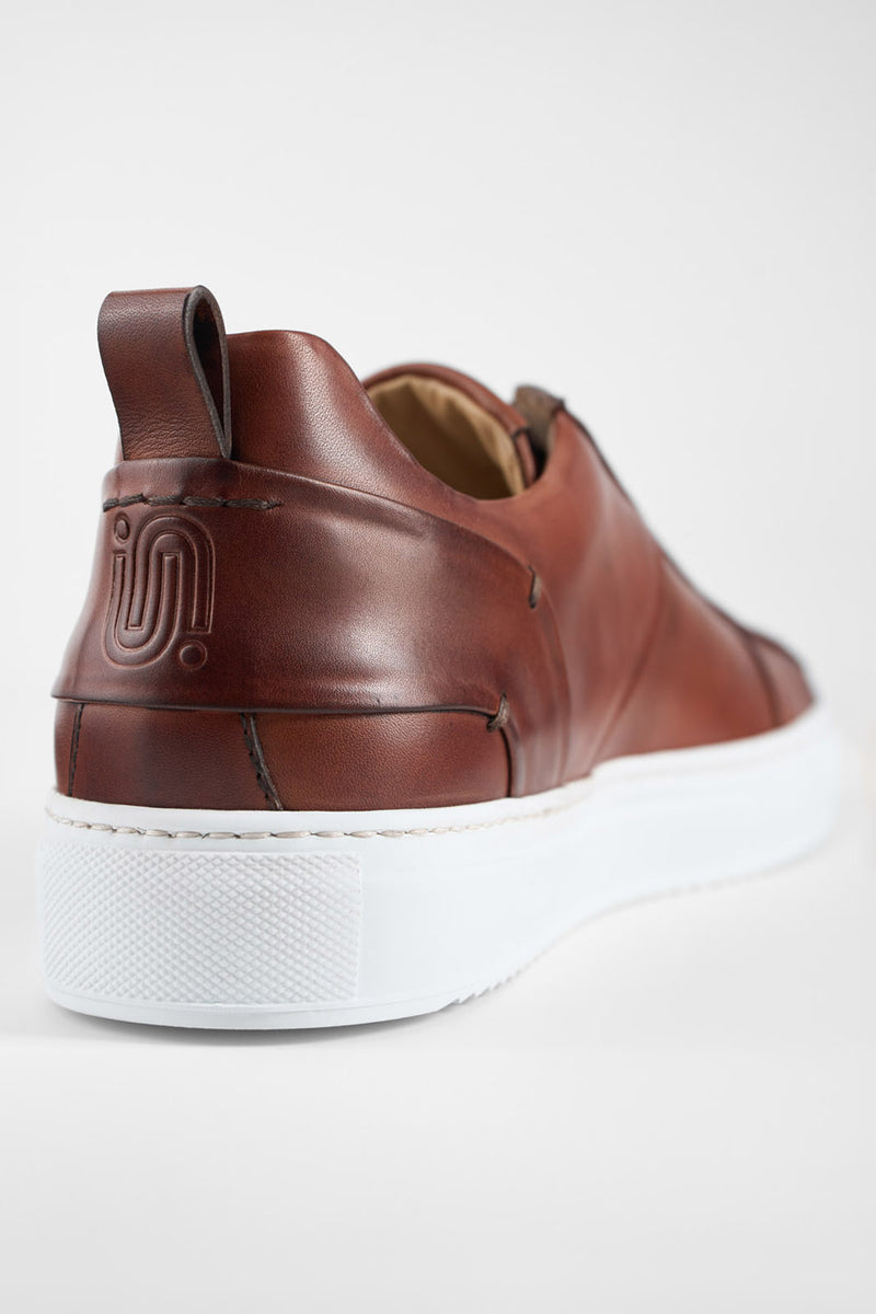 SKYE cognac folded patina sneakers.