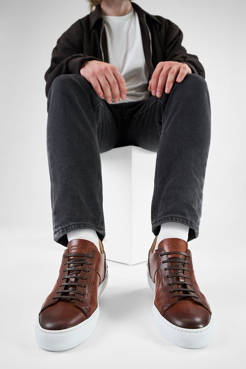 SKYE cognac folded patina sneakers.