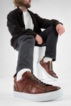 SKYE cognac folded patina sneakers.
