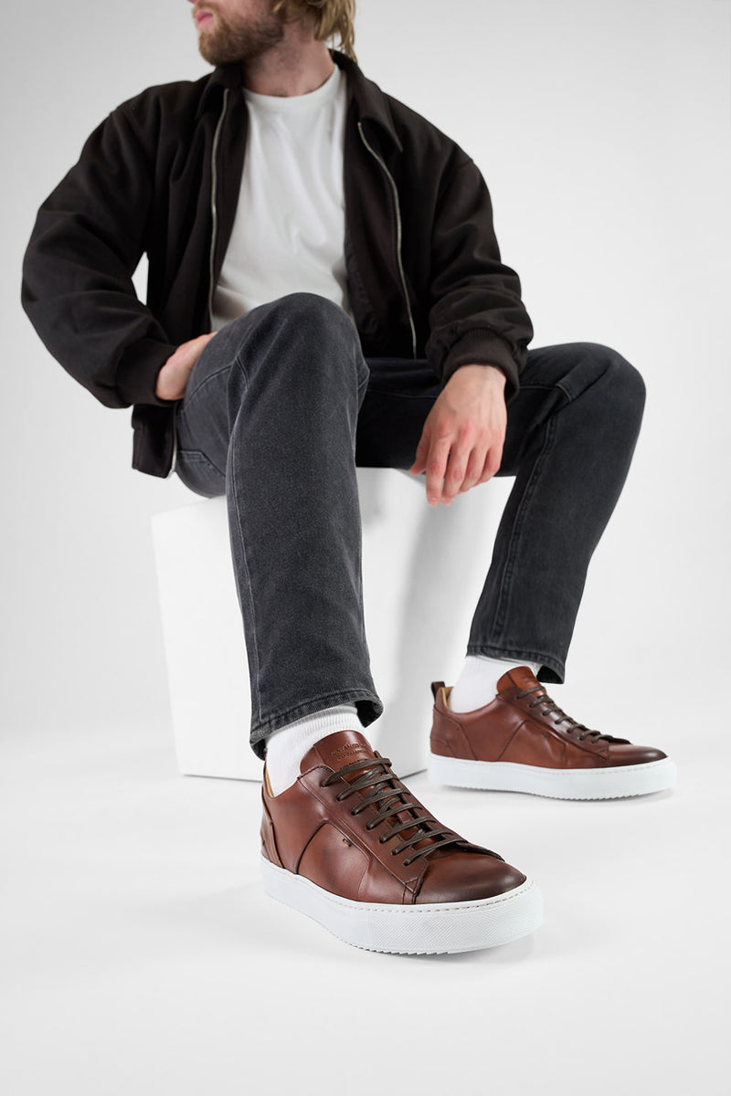 SKYE cognac folded patina sneakers.