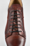 SKYE cognac studded patina sneakers.