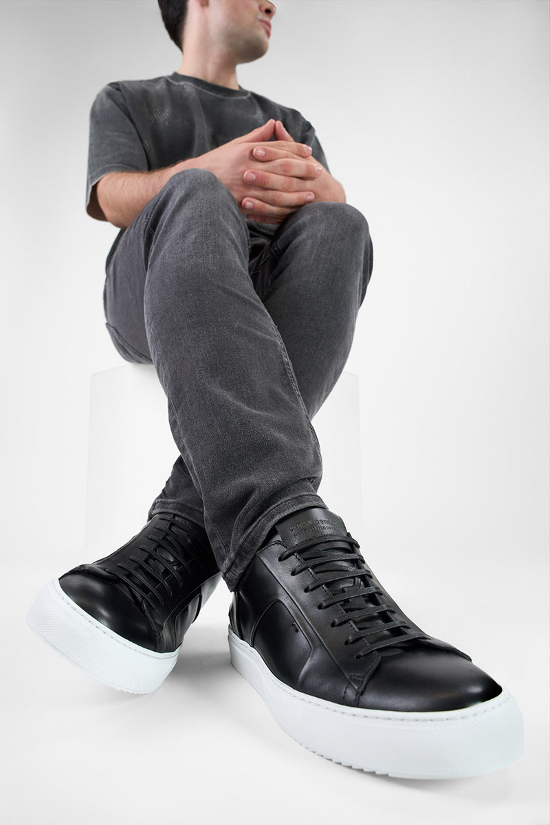 SKYE tuxedo-black folded sneakers.