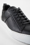 SKYE tuxedo-black folded sneakers.