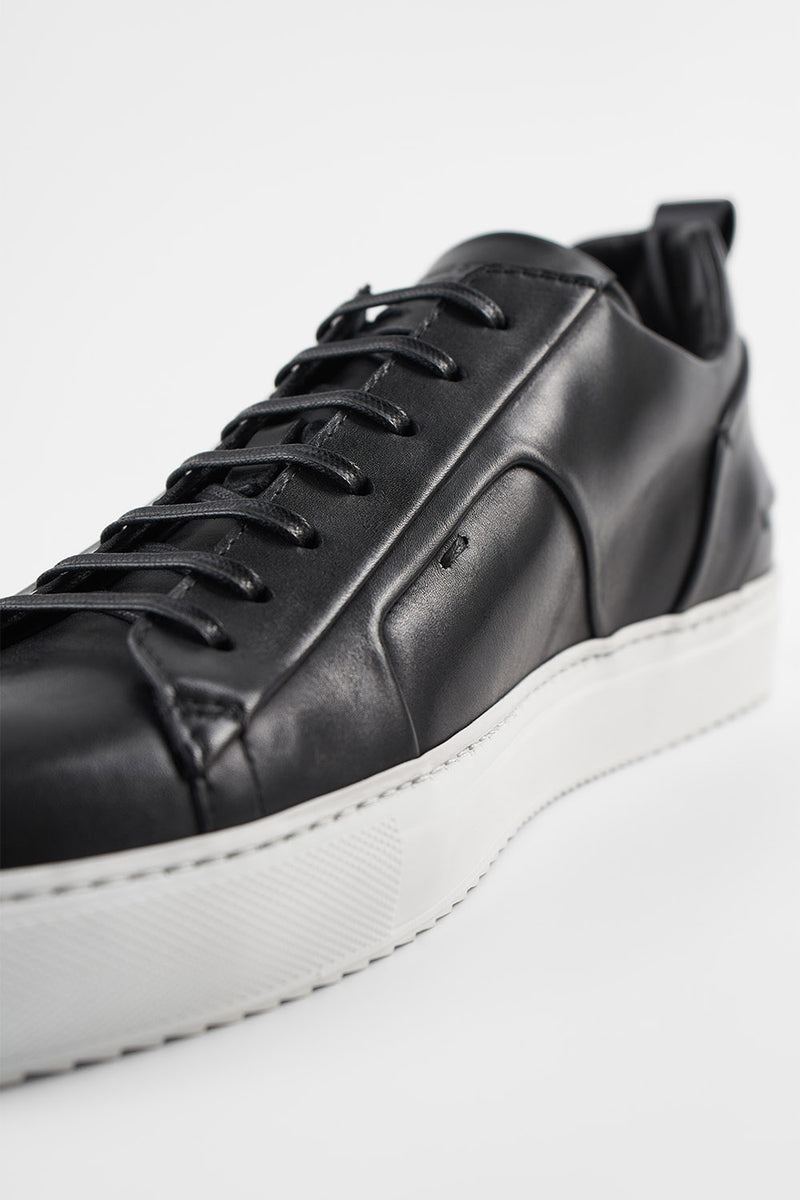 SKYE tuxedo-black folded sneakers.