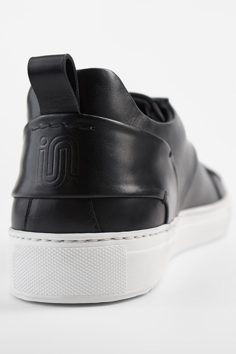 SKYE tuxedo-black folded sneakers.