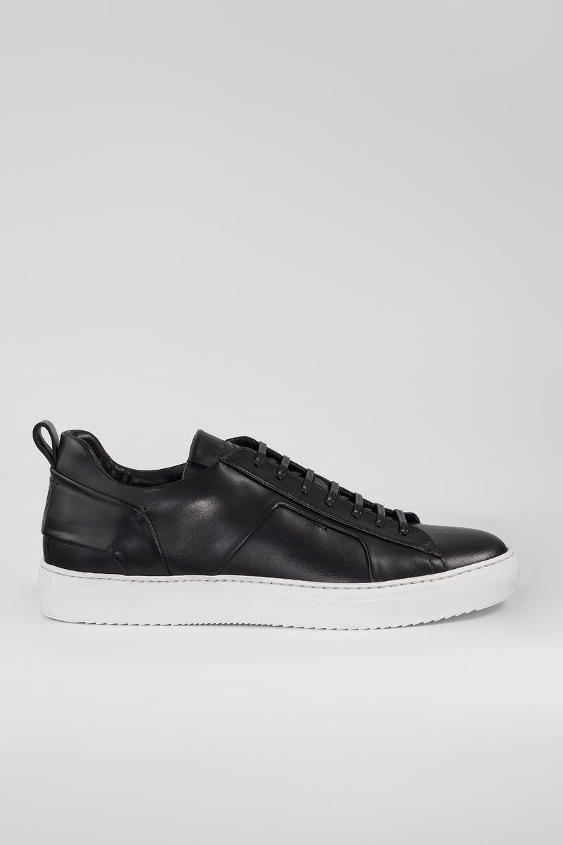 SKYE tuxedo-black folded sneakers.