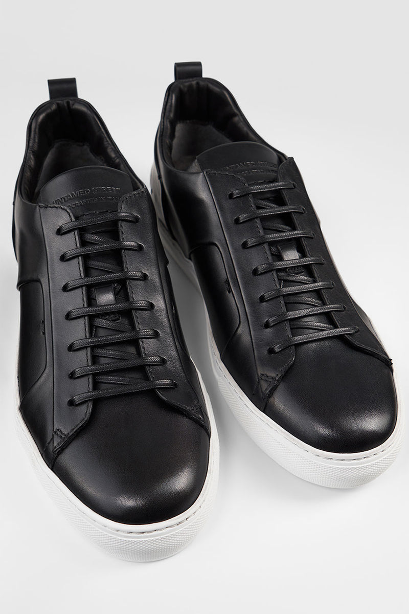 SKYE tuxedo-black folded sneakers.