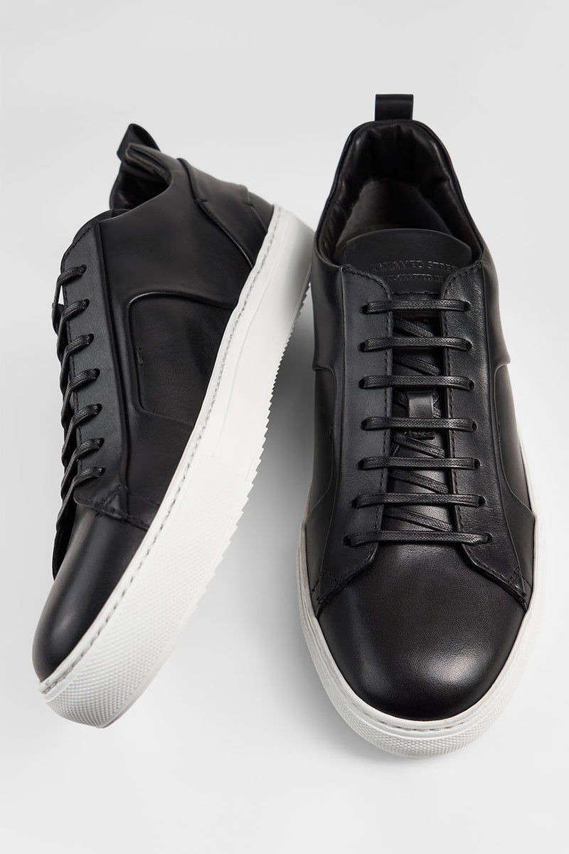 SKYE tuxedo-black folded sneakers.