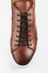 SKYE cognac folded patina sneakers.