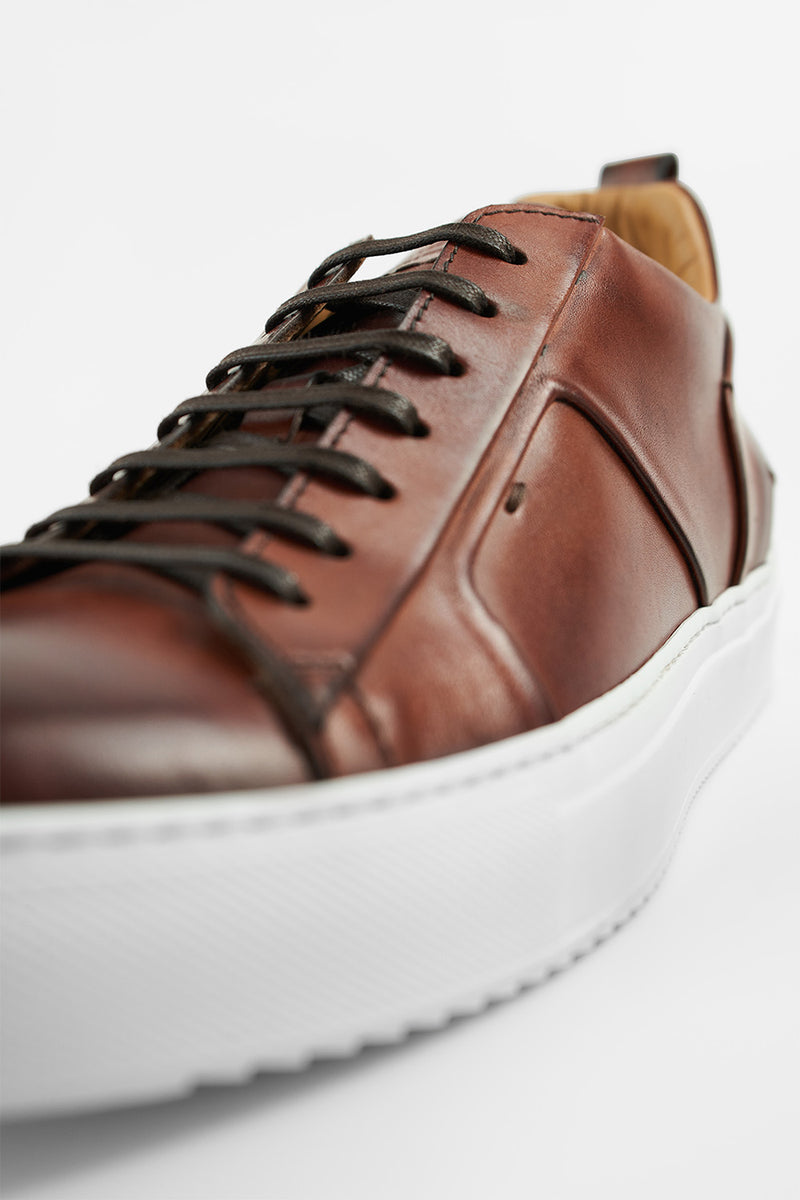 SKYE cognac folded patina sneakers.