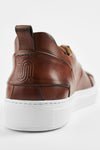 SKYE cognac folded patina sneakers.