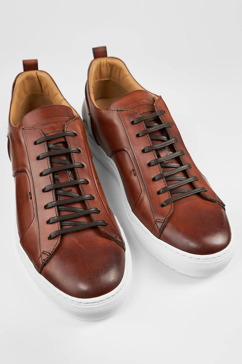 SKYE cognac folded patina sneakers.