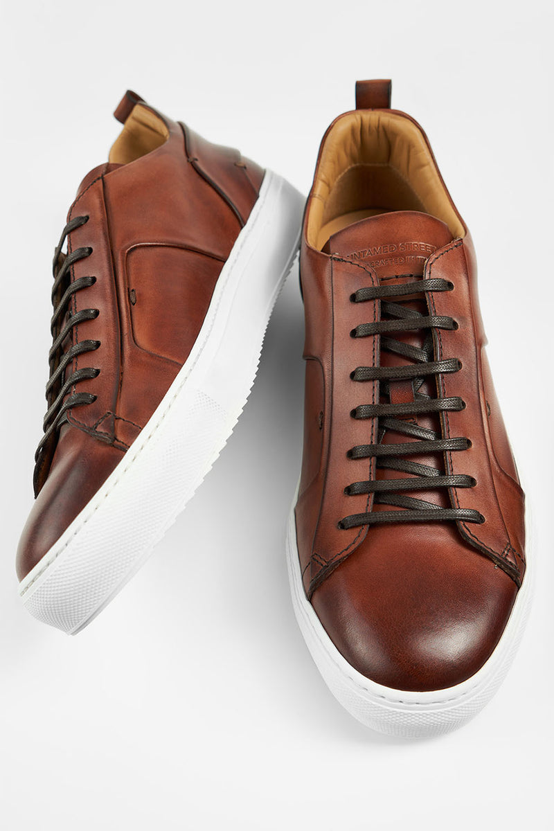 SKYE cognac folded patina sneakers.