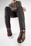 SKYE noble-brown triple stitched patina sneakers.
