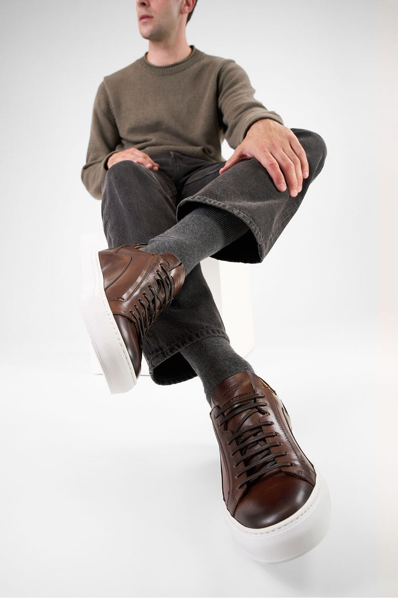 SKYE noble-brown triple stitched patina sneakers.