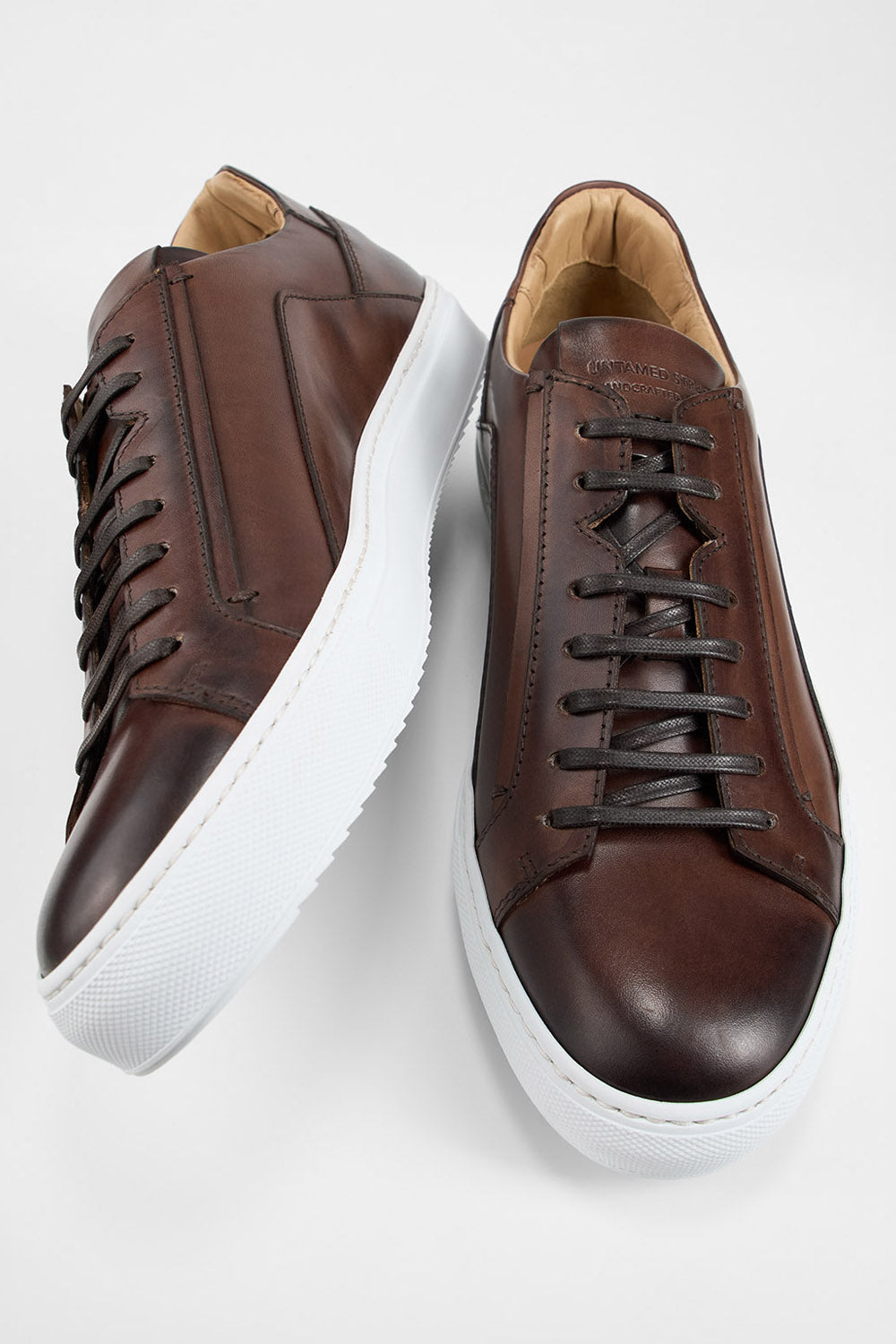 SKYE noble-brown triple stitched patina sneakers.