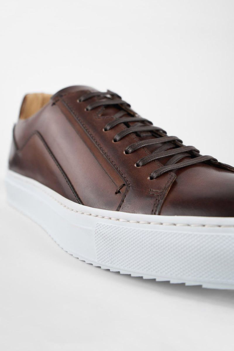 SKYE noble-brown triple stitched patina sneakers.