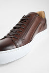 SKYE noble-brown triple stitched patina sneakers.