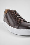 SKYE noble-brown triple stitched patina sneakers.