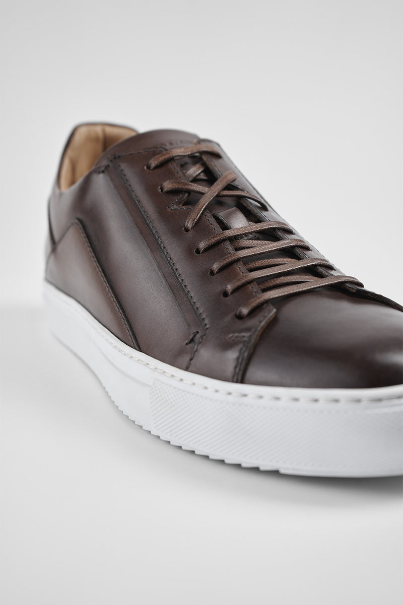 SKYE noble-brown triple stitched patina sneakers.