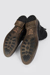SLOANE matte-black lace up buckle boots.