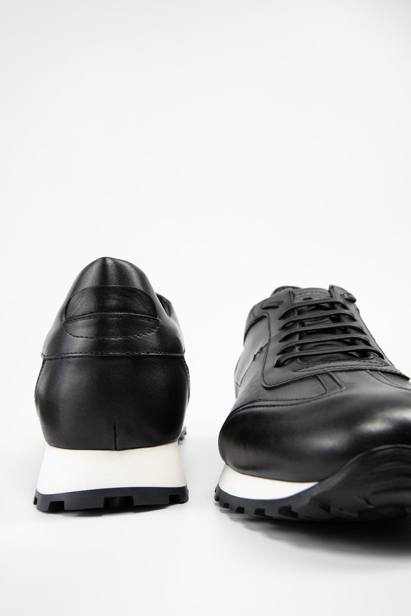 SOHO tuxedo-black wingtip runners.