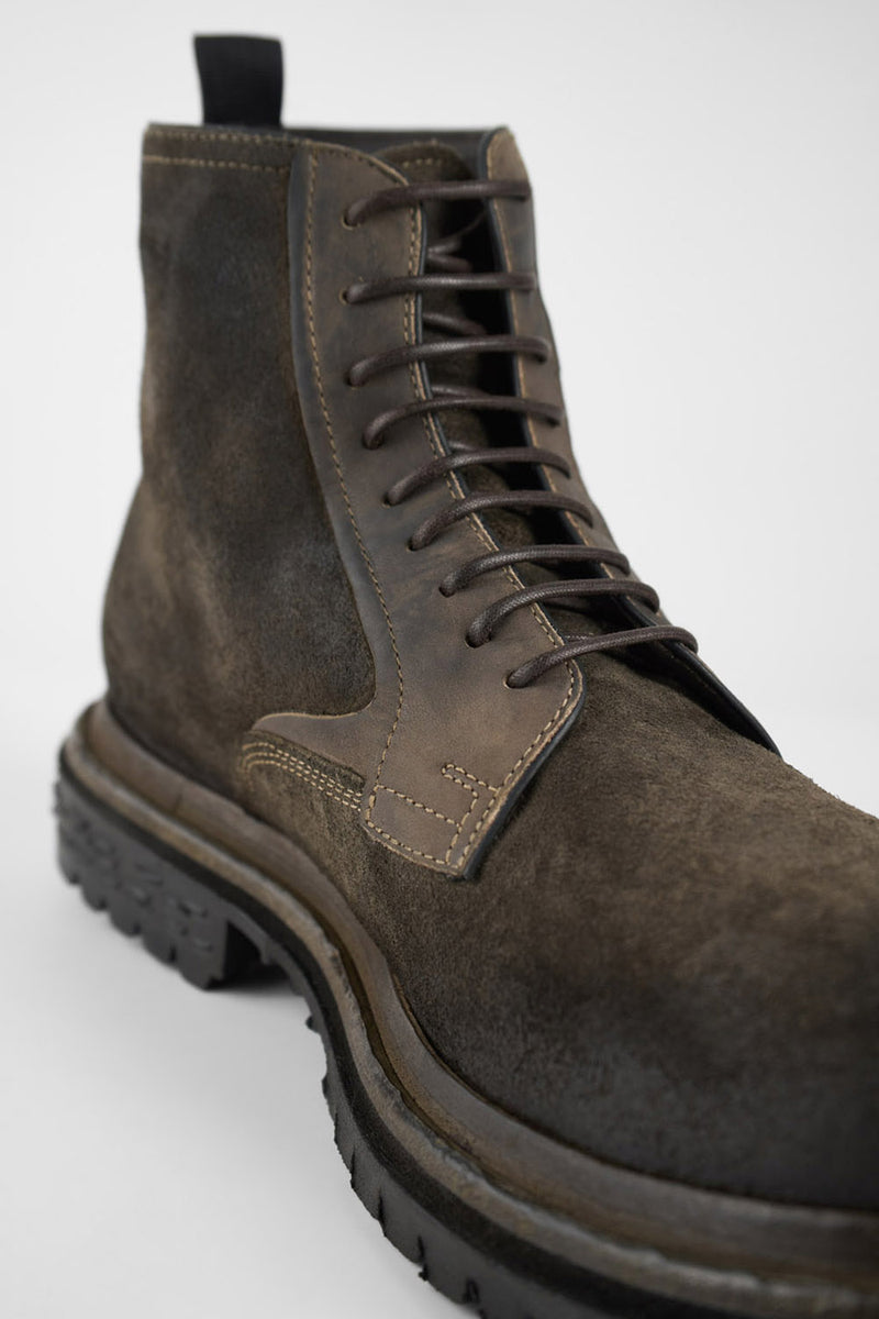 WARRICK dark-moss lace up boots.